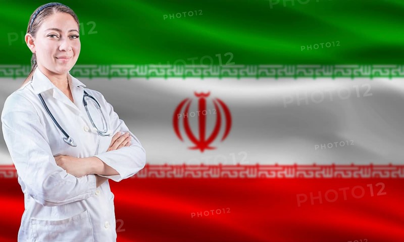 Female doctor on Iran flag. Doctor with crossed arms on Iran flag. Iran health and care concept