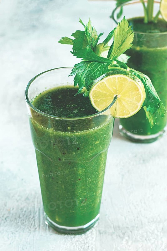 Glass with green smoothie, celery and spinach, apple and kiwi, cucumber, vegetable smoothie, breakfast, homemade, no people