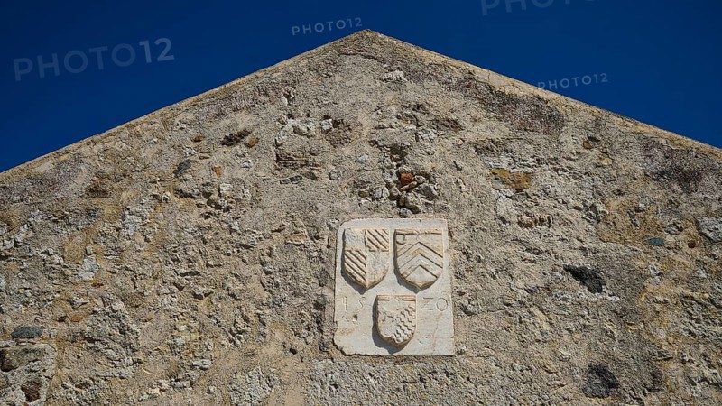 Coat of arms of the Grand Master del Carretto, Relief with coat of arms on the façade of an old building with triangular pediment, Antimacheia, Medieval fortress, St John's fortress, Antimachia, Kos, Dodecanese, Greek Islands, Greece