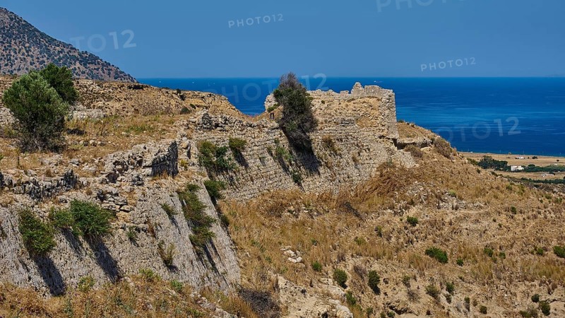 Weathered ruins on a dry coastal hill overlooking the sea, Antimacheia, Medieval fortress, St John's fortress, Antimachia, Kos, Dodecanese, Greek Islands, Greece