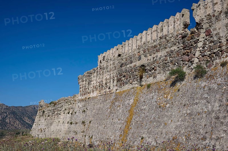 Defence wall, Outer wall, Extensive stone fortifications with vegetation under blue sky, Antimacheia, Medieval fortress, St John's fortress, Antimachia, Kos, Dodecanese, Greek Islands, Greece