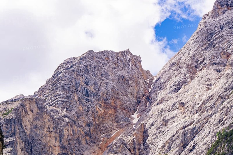 Stony mountain landscape under a blue sky with scattered clouds, Alpe di Siusi, South Tyrol, Dolomites, Italy