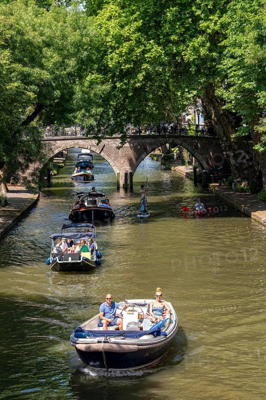 The old town centre of Utrecht, Oudegracht, around 2 km long with many old houses, shops, restaurants directly on the canal, many bridges, boat traffic of all kinds, canal cruise, Netherlands