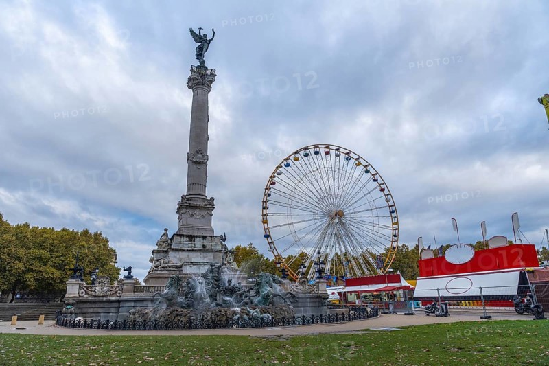 Bordeaux city, ferris wheel near monument aux girondins, a memorial to the girondists, a political group of the french revolution