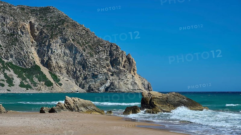 Beach, Kavo Paradiso, Paradise Beach, beach with rocky coast and clear blue sky by the sea, Kefalos, Kos, Dodecanese, Greek Islands, Greece
