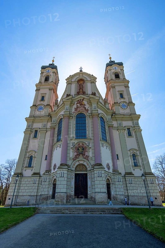 East tower of the baroque Basilica of St Alexander and Theodor, backlit, Ottobeuren Monastery, Ottobeuren, Unterallgäu, Bavaria, Germany