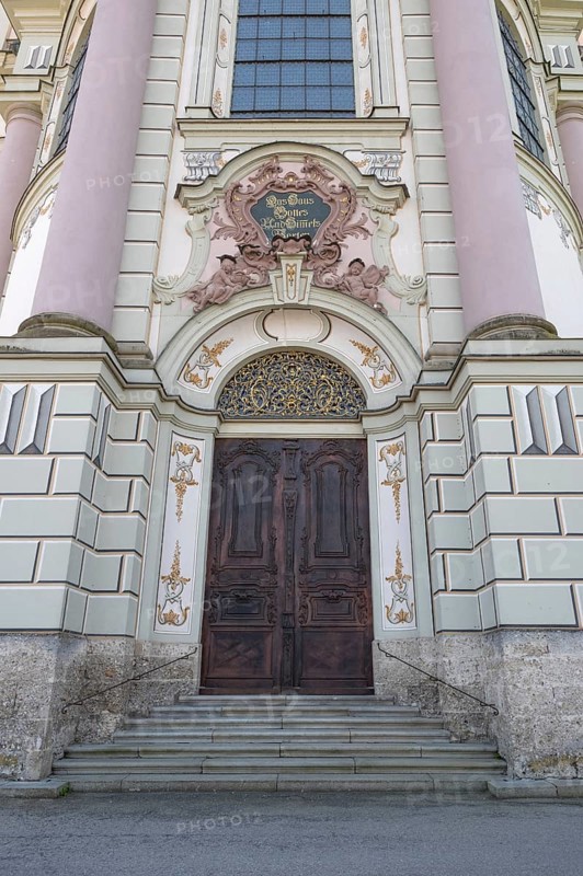 Side entrance portal of the east tower of the baroque Basilica of St Alexander and Theodor, Ottobeuren, Unterallgäu, Bavaria, Germany