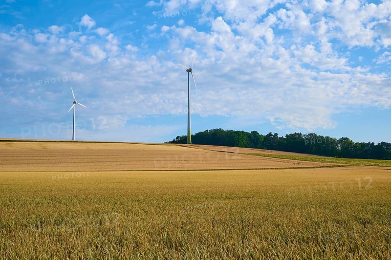 Wide fields with wind turbines under a blue sky and clouds, sustainable energy source, summer, Höhefeld, Wertheim, Baden-Württemberg, Germany