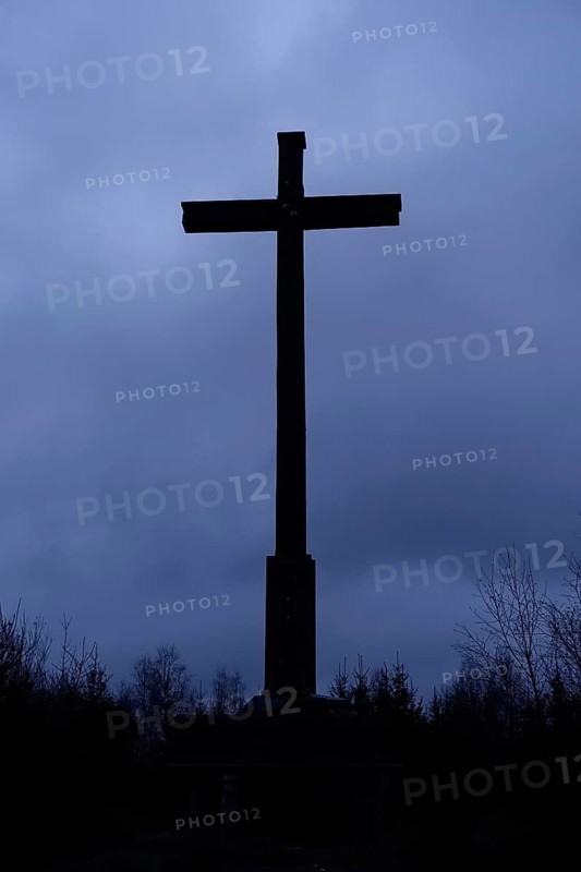 The cross... Schiebergkreuz, Balve, gloomy mood, dark clouds, upcoming thunderstorm, backlight shot, summit cross in the darkness, atmospheric threatening weather conditions, Schiebergkreuz in Balve, Märkischer Kreis, Sauerland, Germany, Western Europe