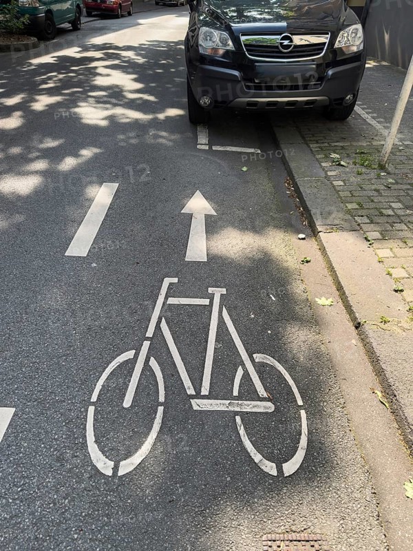 A cycle path on which a car park is marked for cars, Wuppertal, Germany