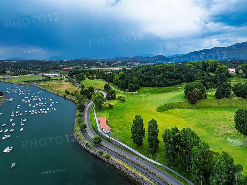 Sunset and storm clouds over Pyrenees and Saint-Jean-de-Luz from a drone, Nouvelle-Aquitaine, Pyrenees-Atlantiques, France