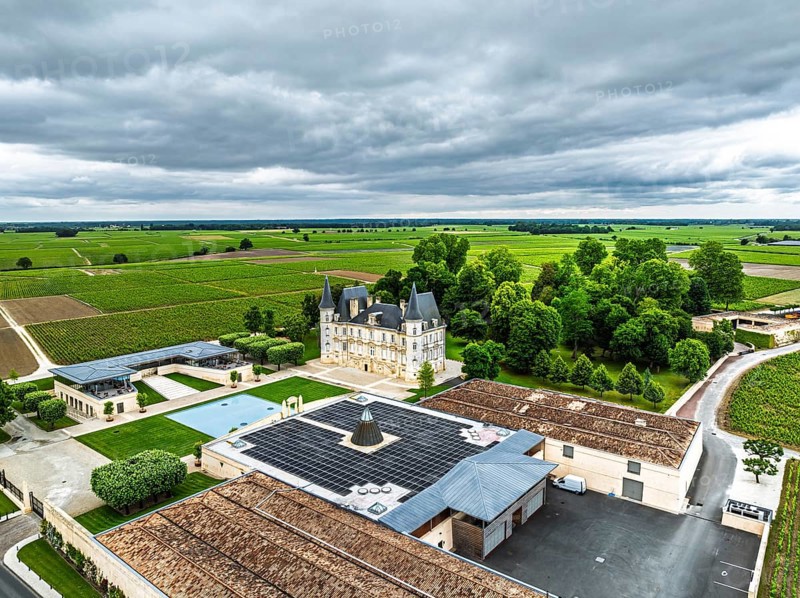 Chateau Pichon Longueville Baron Vineyard and grape fields around Pauillac from a drone, Bordeaux, Gironde, Nouvelle-Aquitaine, France