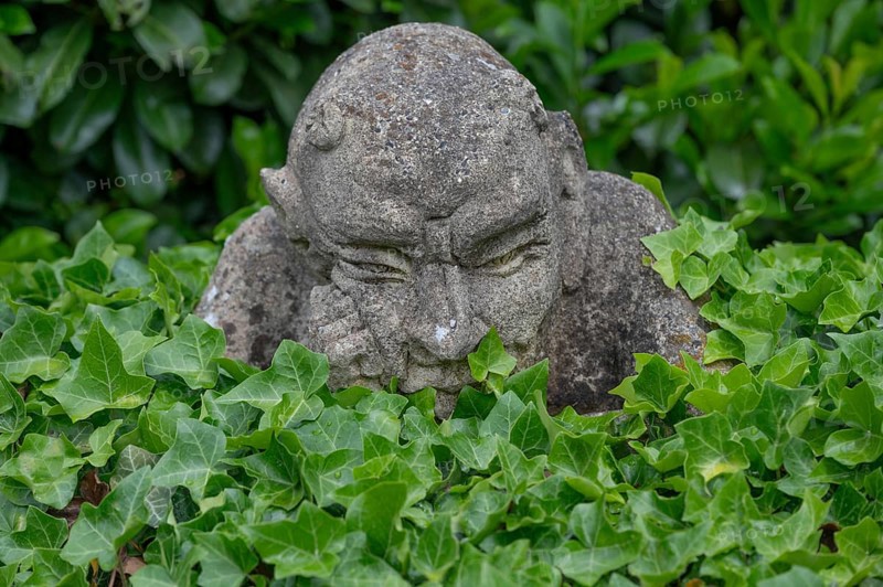 Stone sculpture, grotesque in a garden, Bavaria, Germany