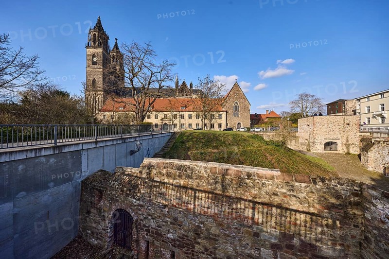 Magdeburg Cathedral, Gothic architectural style, Cleve bastion, Cleve defence defence tower, city fortifications, lawn, metal railings, shade, bare winter trees, blue sky, cumulus clouds, Am Dom, Magdeburg, state capital, independent city, Saxony-Anhalt, Germany