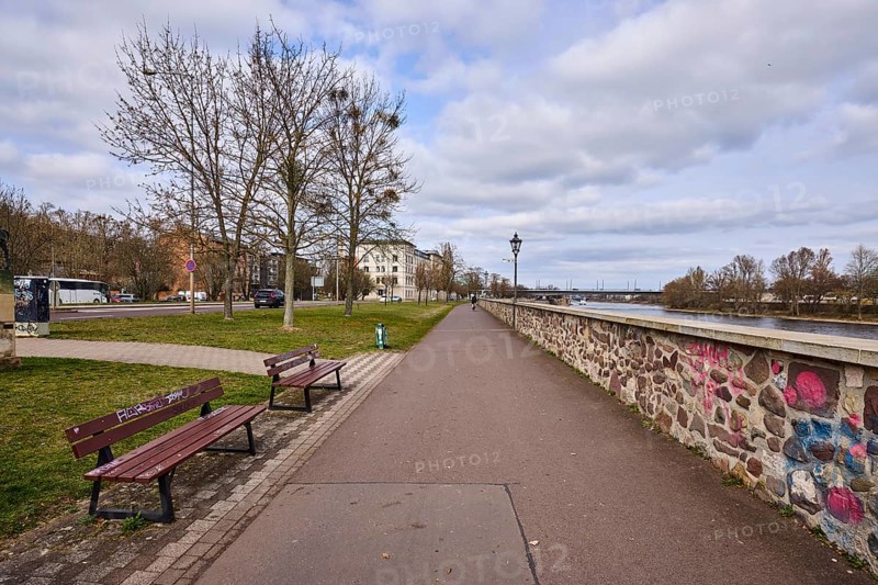 River Elbe, riverside promenade, lantern, benches, sandstone wall, bare wintry trees, general architecture, diffuse light, blue sky, cumulus clouds, banks of the river Schlein, Magdeburg, state capital, independent city, Saxony-Anhalt, Germany