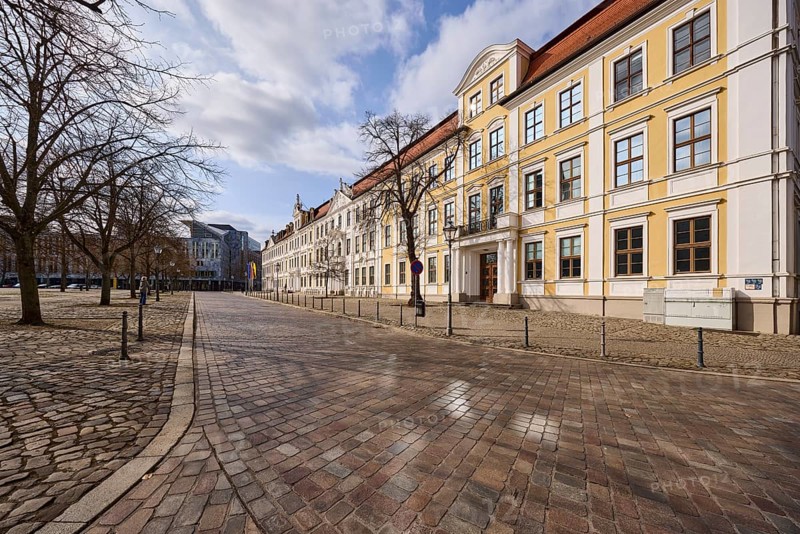 State parliament, historic houses, baroque architectural style, bollards, bare winter trees, cobblestone pavement, square, blue sky, cumulus clouds, cathedral square, Magdeburg, state capital, independent city, Saxony-Anhalt, Germany