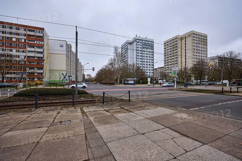High-rise buildings, residential buildings, residential silos, tram tracks, overhead lines, diffuse light, cloudy, intersection Salvador-Allende-Straße with Barleber Straße, Magdeburg, state capital, independent city, Saxony-Anhalt, Germany