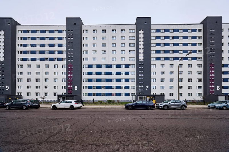 High-rise building, residential building, residential silo, façade with windows, car park with vehicles, diffuse light, cloudy, Salvador-Allende-Straße, Magdeburg, state capital, independent city, Saxony-Anhalt, Germany