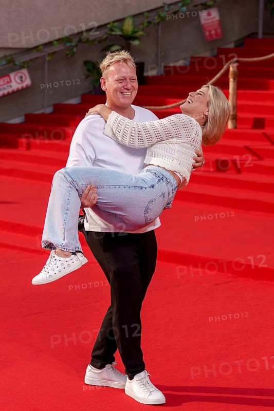 Jens Knossi Knossalla with girlfriend Lia Mitrou (influencer) at the German premiere of the adventure film Jurassic World: Rebirth at Berlin's Zoo Palast on 18 June 2025
