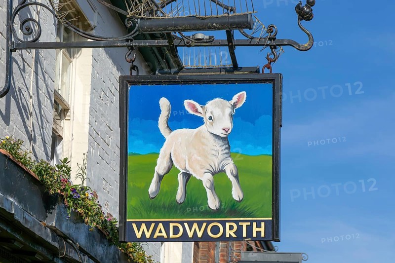 Wadworth brewery traditional pub sign, The Lamb, Marlborough, Wiltshire, England, UK
