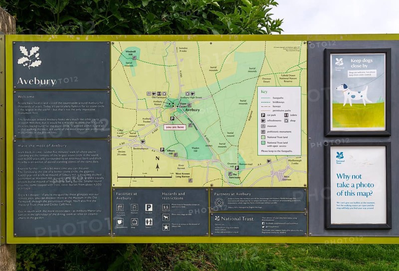 Information board with map at prehistoric stone circle site at village of Avebury, Wiltshire, England, UK