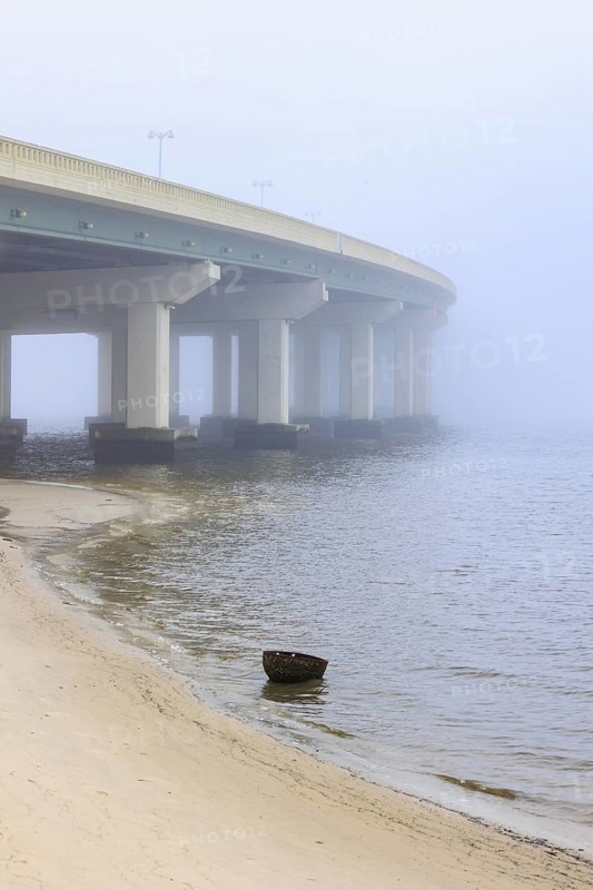 US Highway 90 bridge over the Biloxi Bay disappears into the dense fog at Ocean Springs, Mississippi