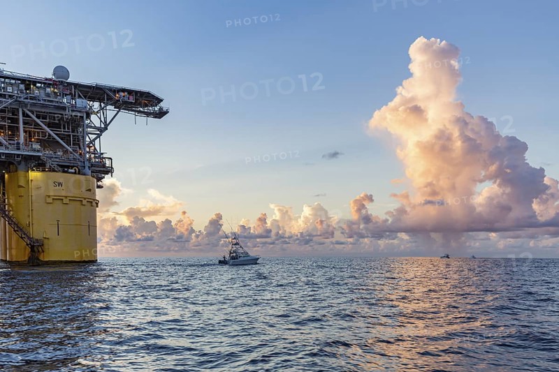 Private fishing boats near offshore petroleum drilling rig in the Gulf of Mexico