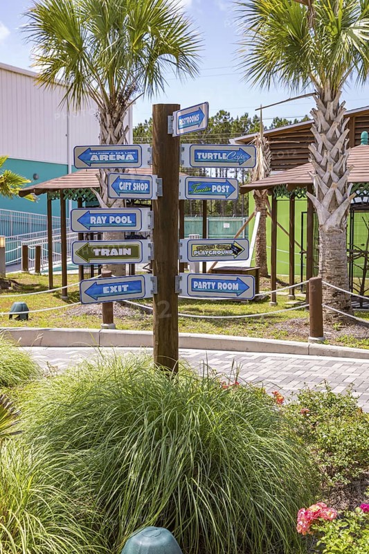 Sign directs guests to different attractions at Ocean Adventures Marine Park in Gulfport, Mississippi