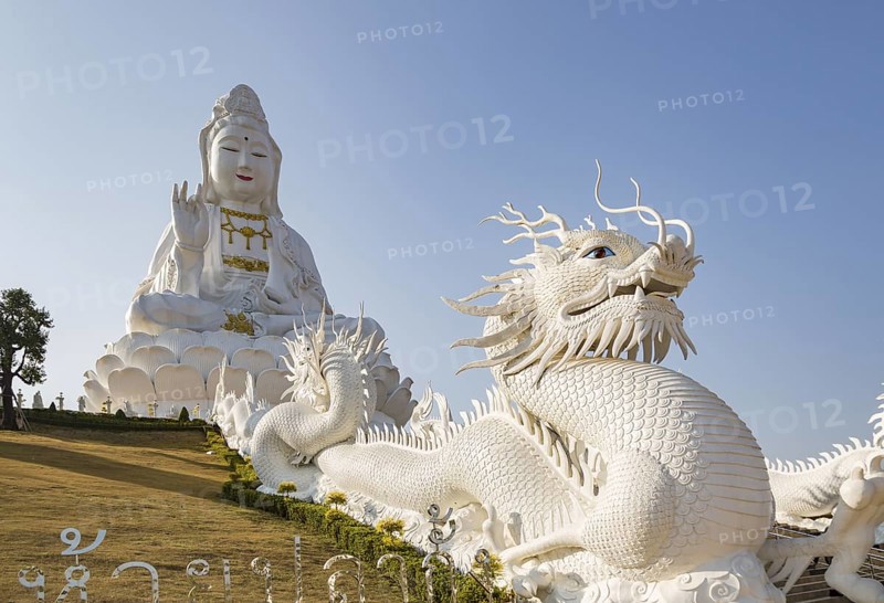 Chinese dragons line the steps up to the Guan Yin (Goddess of Mercy) statue at Wat Huay Pla Kang Temple in Chiang Rai province of Northern Thailand