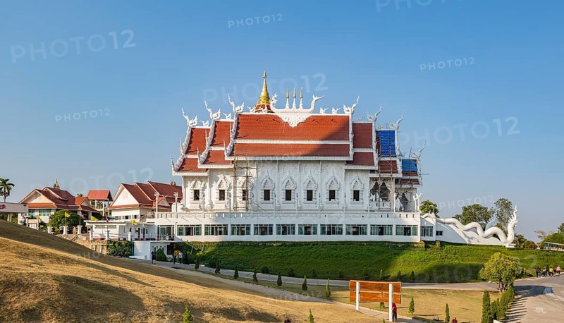 Bamboo scaffolding installed for roof repairs at the Viharn assembly hall at Wat Huay Pla Kang in Chiang Rai, Thailand