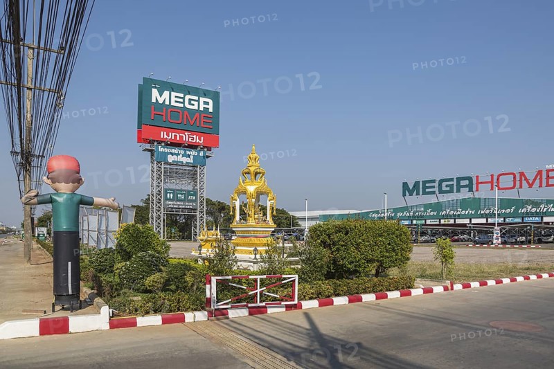 Buddahist shrine outside of the Mega Home building materials warehouse store in Chiang Rai province of Northern Thailand