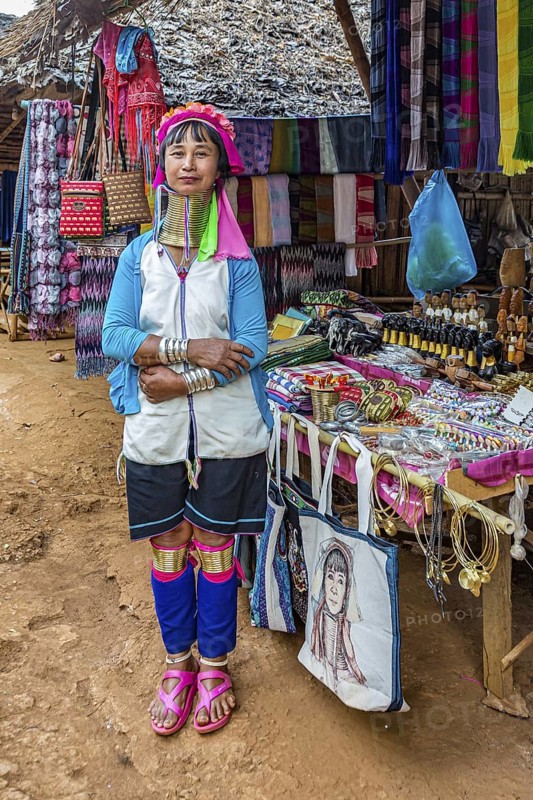 Tribal woman selling woven scarves and other crafts in the Long Neck Karen tribe (more properly called the Kayah Lahwi tribe) area of the Union of Hill Tribe Villages outside of Chiang Rai in the Nanglae District of Thailand