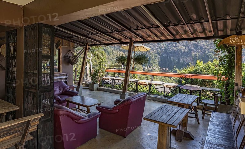 Stairs lead down to the Doi Phamee coffee shop and restaurant in Mae Sai district of Chiang Rai, Thailand