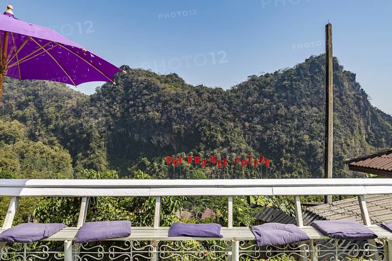 Sign on outdoor bench at the Doi Phamee coffee shop and restaurant, in Mae Sai district of Chiang Rai, Thailand