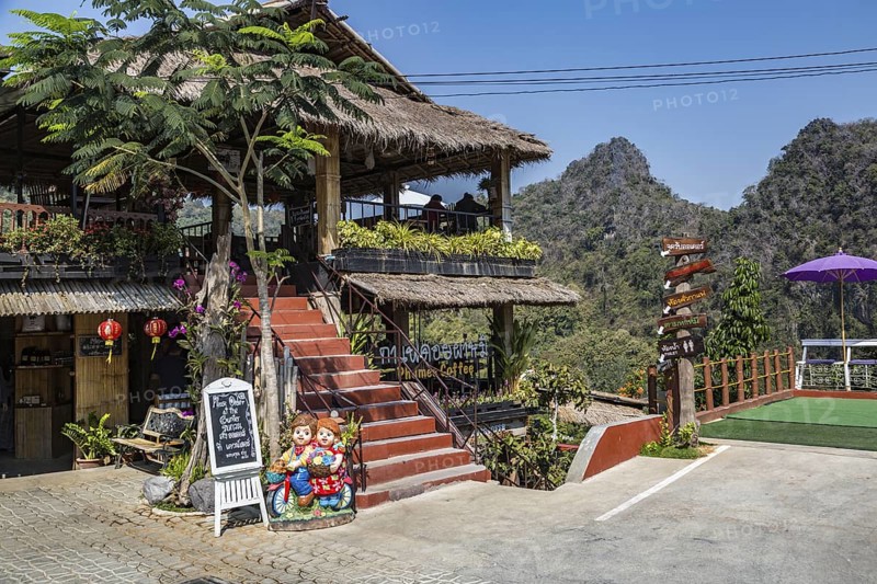 Stairs lead up to the dining area and down to the gardens at the Doi Phamee coffee shop and restaurant in Mae Sai district of Chiang Rai, Thailand