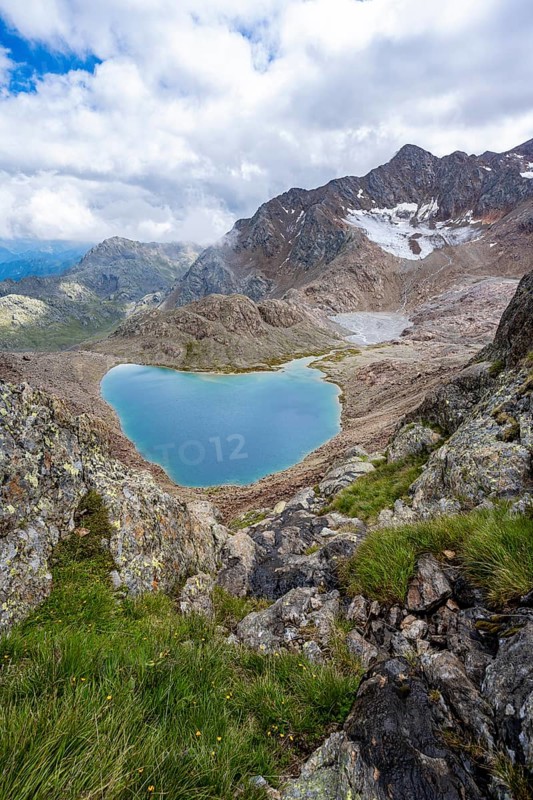 High mountain landscape, view of mountains with mountain lake Vogelhüttensee, Stubai Alps, South Tyrol, Italy