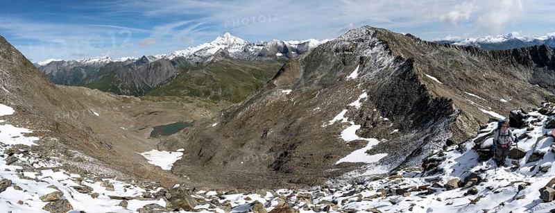 View above the Kesselkeessattel, mountain landscape with Kesselkeessee, snow-covered summit of the Großglockner in the background, Wiener Höhenweg, Schober group, Hohe Tauern National Park, Carinthia, Austria