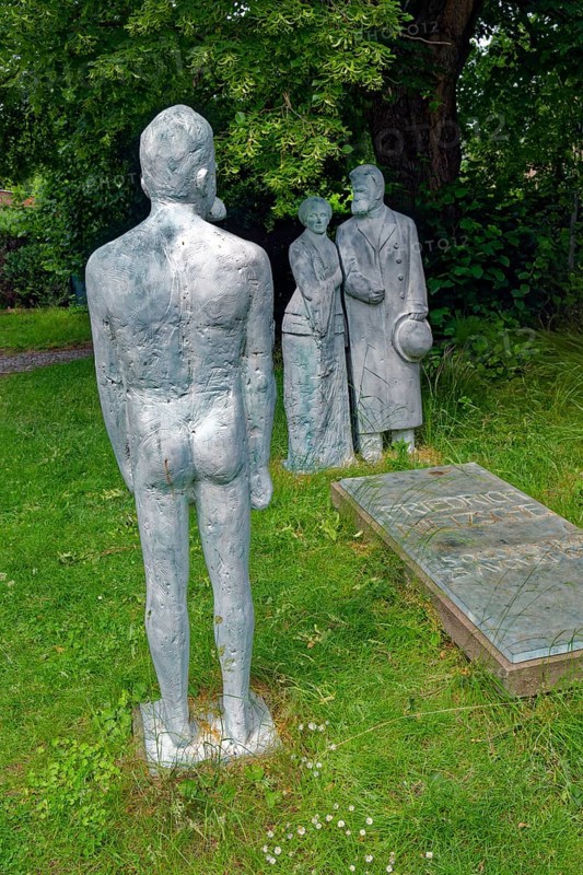 The philosopher Nietzsche as a dream image and Friedrich Nietzsche on his mother's arm at his grave, sculptures Röckener Bacchanal by Klaus F. Messerschmidt, Röcken, town of Lützen, Saxony-Anhalt, Germany