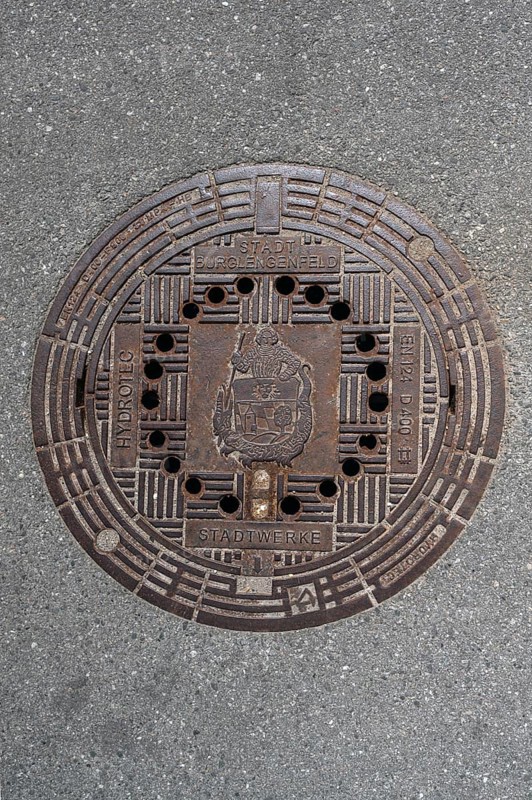 Manhole cover with the coat of arms of Burglengenfeld, Upper Palatinate, Bavaria, Germany