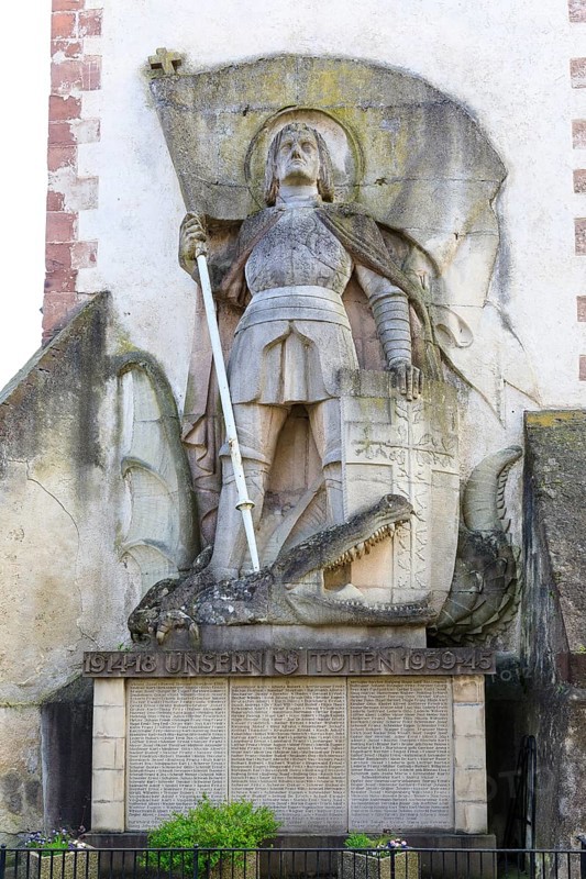 St George the Dragon Slayer with dragon on the exterior façade of St Martin's Church in Endingen am Kaiserstuhl, Baden-Württemberg, Germany