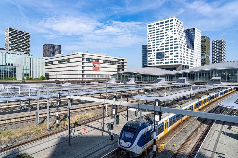 Utrecht Centraal railway station, tracks and concourse, trains of Nederlandse Spoorwegen N.V. state railway company, office building in the city centre, Netherlands