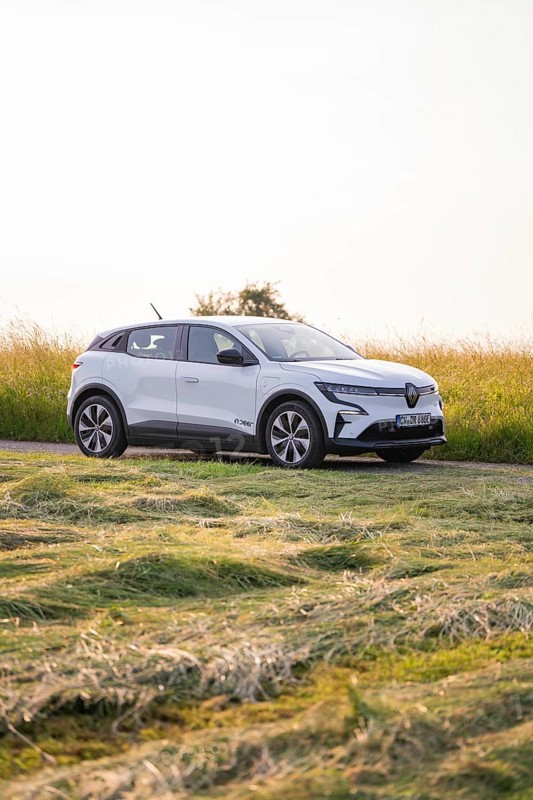 White car on a rural road in Sommerfeld, Renault Megane, Deer E Carsharing, electric car, Calw, Black Forest, Germany