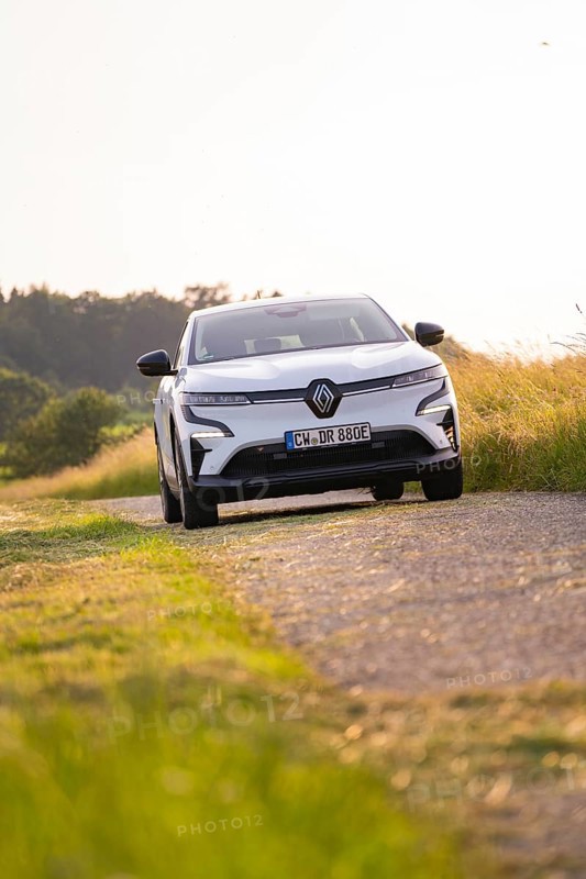 White car driving on a rural road in summer, Renault Megane, Deer E Carsharing, electric car, Calw, Black Forest, Germany