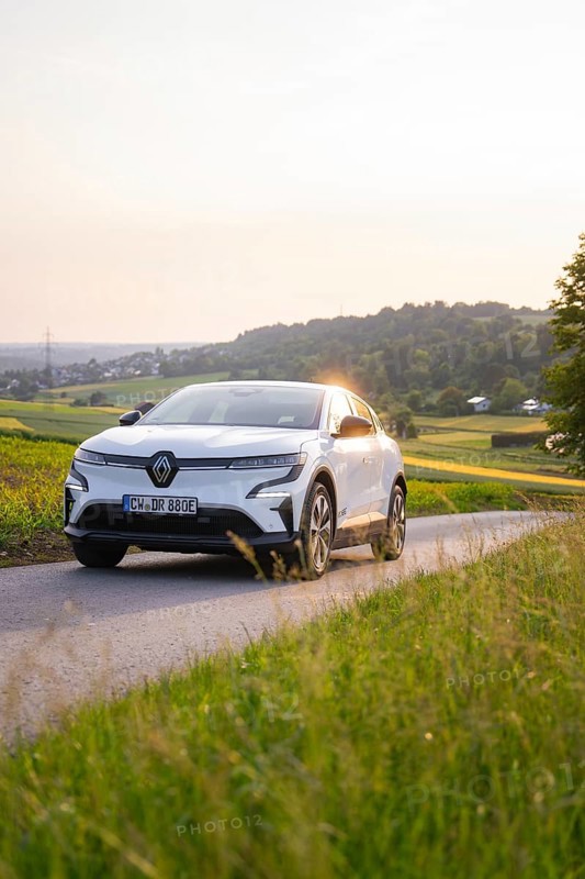 White car driving on a country road in the evening sunshine, Renault Megane, Deer E- Carsharing, electric car, Gechingen, Germany