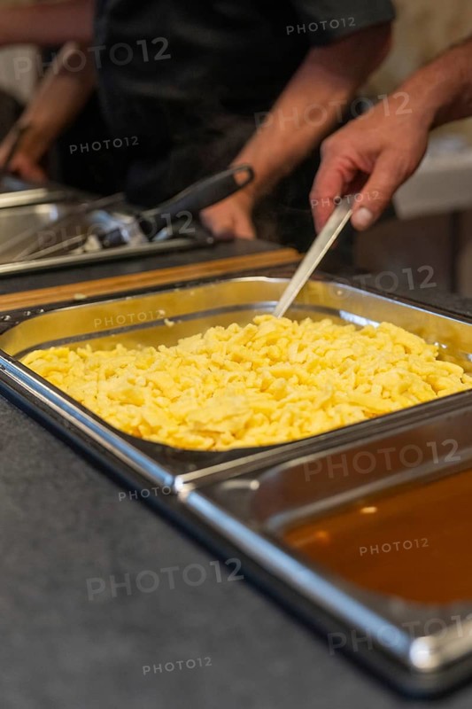 Fresh spaetzle is served in a tray at the buffet, Event and wedding location Kloster Lorch, Lorch, Germany