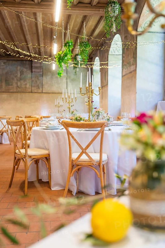 Elegant wedding decoration in a rustic ballroom with candles and flower arrangements, event and wedding location Lorch Monastery, Lorch, Germany