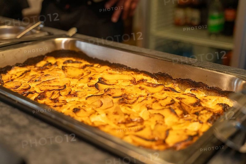 A baked potato casserole in a large tray, baked golden brown, event and wedding location Kloster Lorch, Lorch, Germany