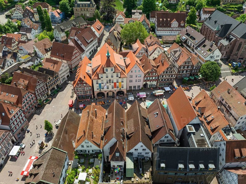 Aerial view of an old town with half-timbered houses and a busy square in an urban environment, Calw, Black Forest, Germany