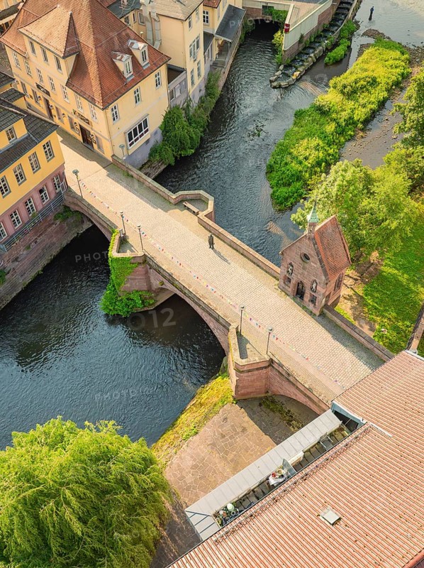 A historic bridge over a quiet river in a picturesque town, Calw, Black Forest, Germany