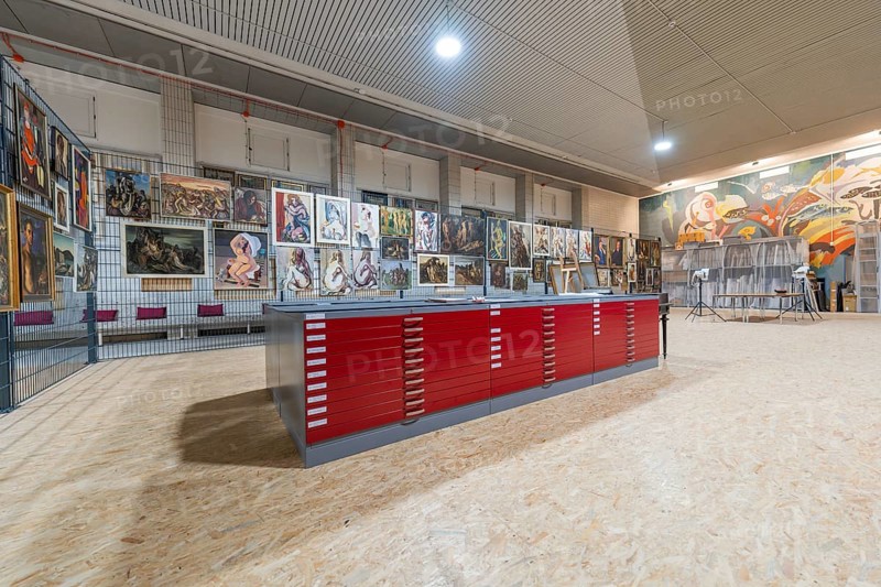 Gallery exhibition with red cabinets and paintings on the wall, historical art exhibition in the old swimming pool, Schaudepot, Calw, Black Forest, Germany